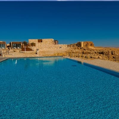 Large crystal-clear resort-style pool serviced by Arizona Pool Care Pros